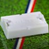 White plastic electric football bases