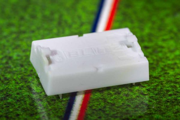 White plastic electric football bases