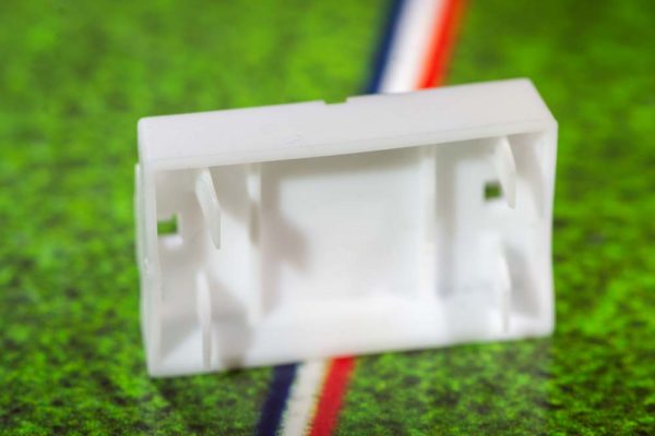 White plastic electric football bases
