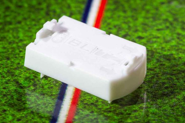 White plastic electric football bases