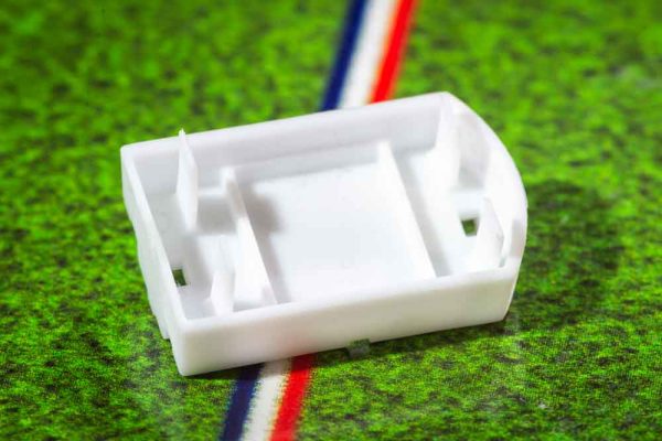 White plastic electric football bases