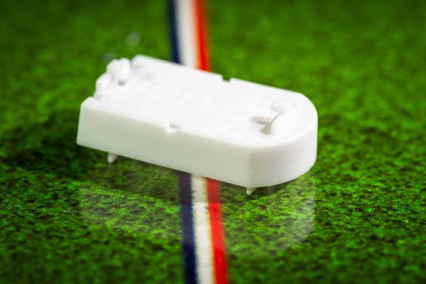 White plastic electric football bases