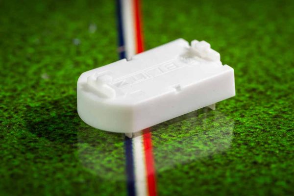 White plastic electric football bases