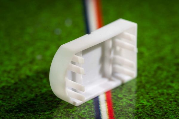 White plastic electric football bases