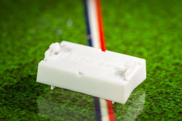 White plastic electric football bases