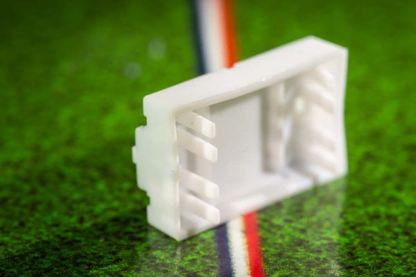 White plastic electric football bases