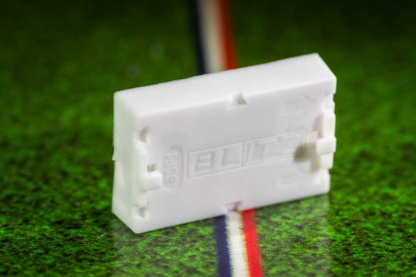 White plastic electric football bases